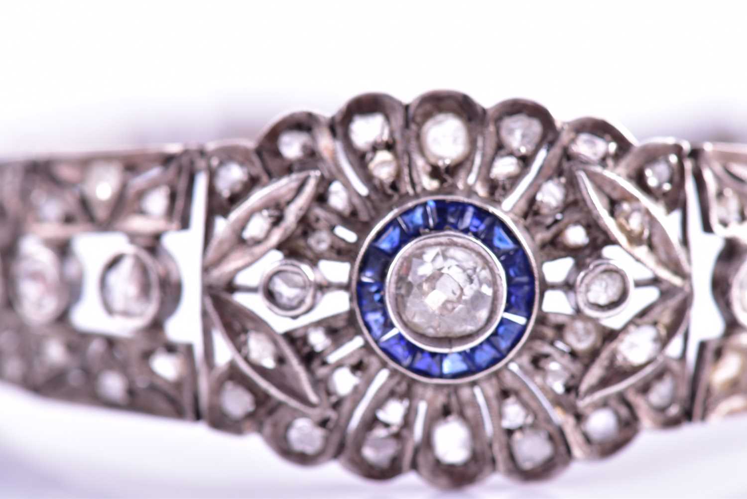 An early 20th century diamond and sapphire bracelet, the articulated mount centred with an old-cut - Image 5 of 8