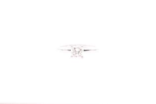 An 18ct white gold and solitaire diamond ring, set with a round brilliant-cut diamond, approximate