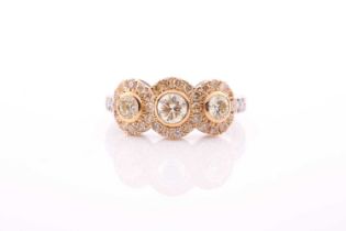 An 18ct yellow gold, platinum, and diamond ring, the yellow gold triple cluster mount inset with
