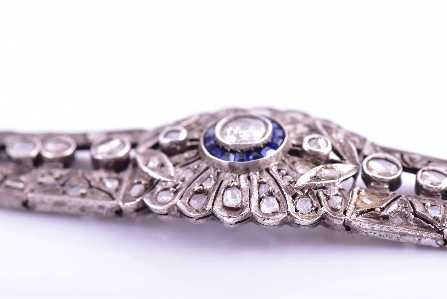 An early 20th century diamond and sapphire bracelet, the articulated mount centred with an old-cut - Image 4 of 8