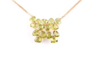 A peridot pendant; with centre composed of five three stone foliate clusters each set with the heart