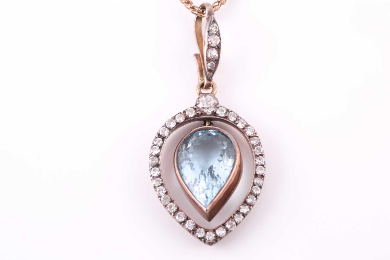 A late 19th / early 20th century diamond and aquamarine pendant, the tapered frame mount inset