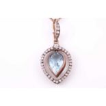 A late 19th / early 20th century diamond and aquamarine pendant, the tapered frame mount inset