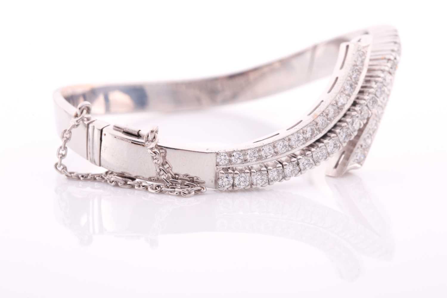 A diamond bangle of crossover design, inset with graduated round brilliant-cut diamonds of - Image 3 of 5