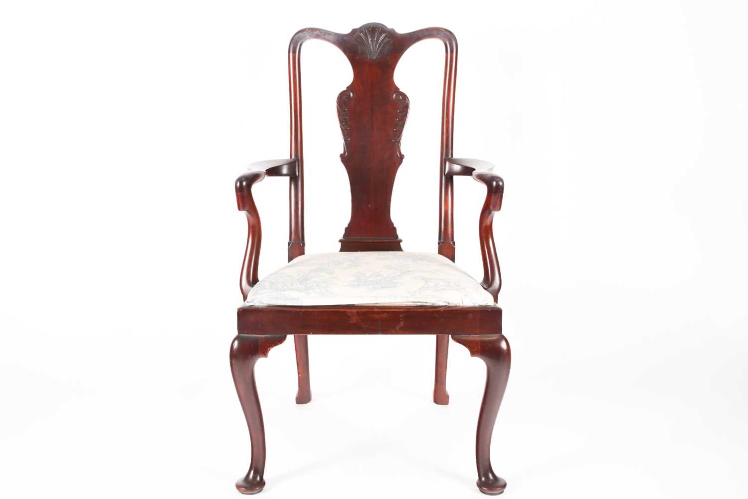 A George II style mahogany open arm carver chair with carved vase splat, crook arms above a drop