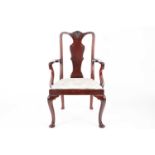 A George II style mahogany open arm carver chair with carved vase splat, crook arms above a drop