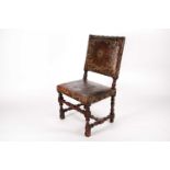 A late 17th century walnut "Farthingale" type side chair with decorative studded stuff over "