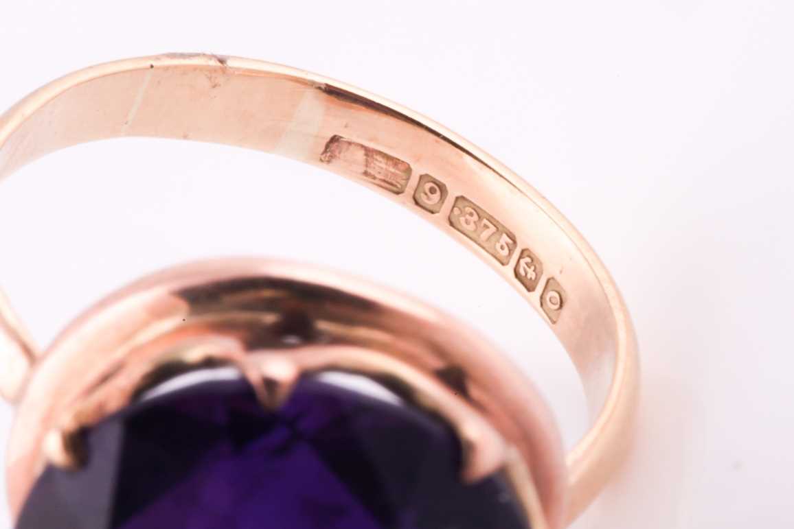 A 1960's amethyst solitaire ring, the round brilliant cut amethyst, approximately 10 carats, set - Image 5 of 5