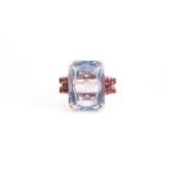 A 1940s/50s yellow metal dress ring; set with a mixed rectangular-cut blue synthetic spinel, the