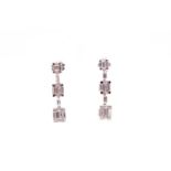 A pair of 18ct white gold and diamond drop earrings, each set with three graduated rectangular