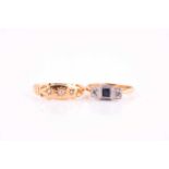 An Edwardian three stone half hoop sapphire and diamond ring; in millegrain set illusion mounts;