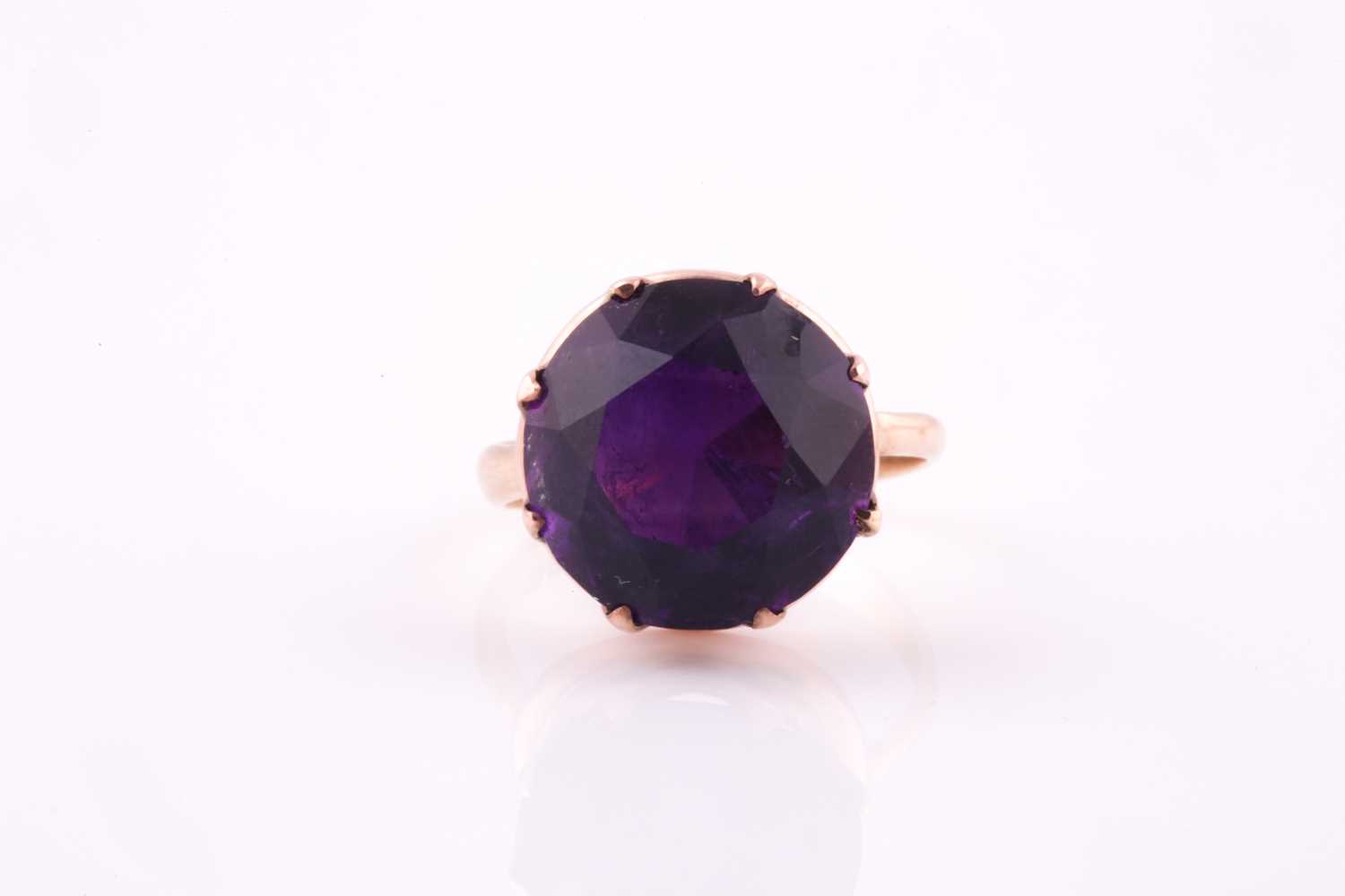 A 1960's amethyst solitaire ring, the round brilliant cut amethyst, approximately 10 carats, set