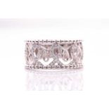 An 18ct white gold and diamond half eternity band, the openwork band inset with small diamonds,