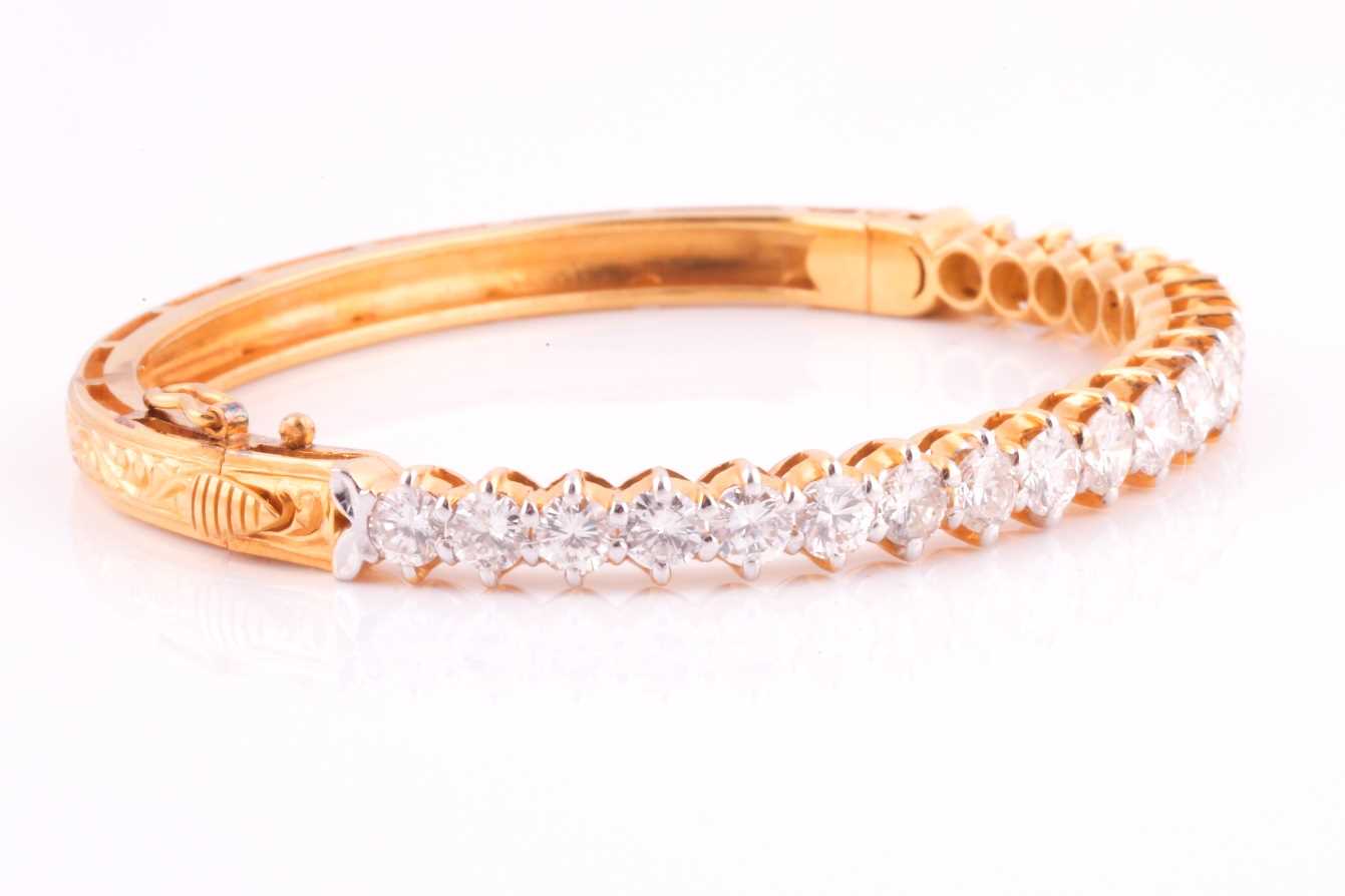 A diamond bangle; the centre set with twenty one graduated round brilliant cut diamonds in claw - Image 4 of 5