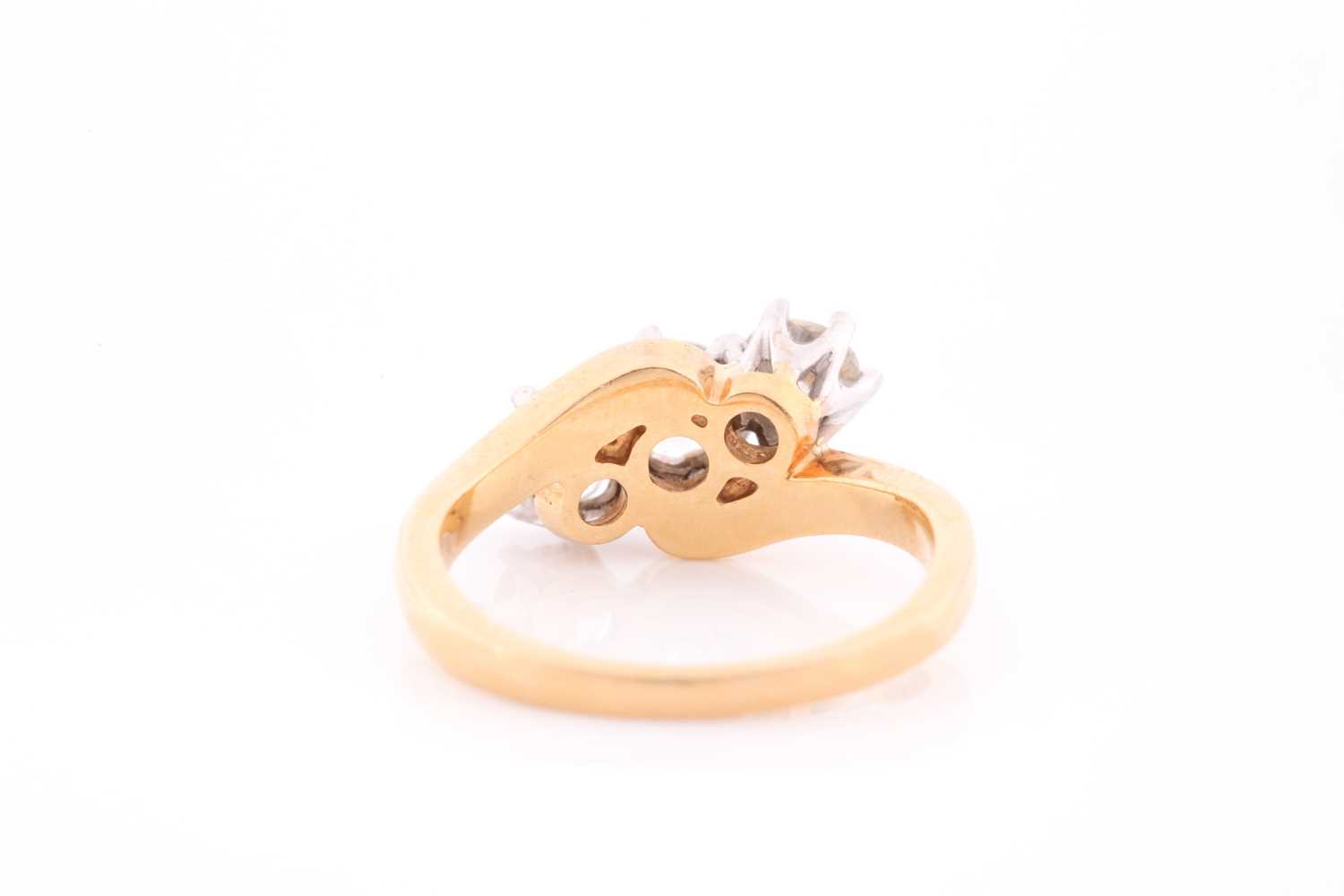 An 18ct yellow gold and diamond crossover ring, set with three round brilliant-cut diamonds of - Image 3 of 4