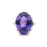 An 18ct white gold, diamond and tanzanite dress ring, set with a mixed oval-cut tanzanite of