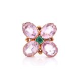 A 19th century pink topaz floral brooch, set with four mixed oval-cut topaz and centred with a small