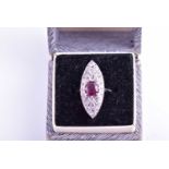 An 18ct white gold, diamond, and ruby ring, the marquise-shaped mount inset with a mixed round-cut