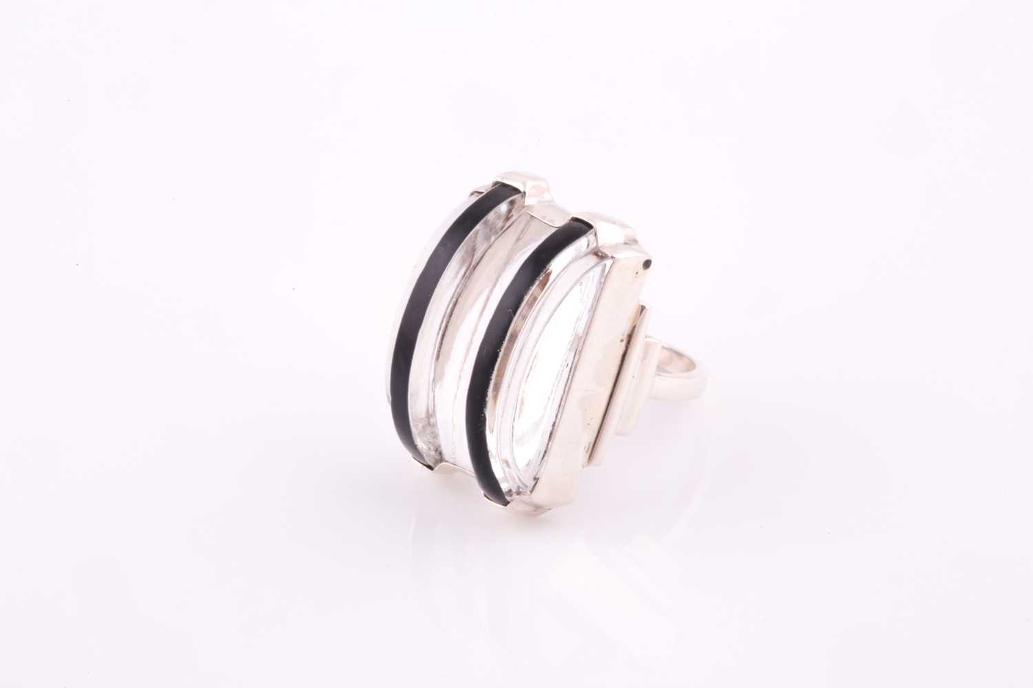 A sterling silver and plastic Art Deco style cocktail ring, with curved clear and black plastic