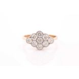 An 18ct yellow gold and diamond ring, set with a cluster of nine round brilliant-cut diamonds of