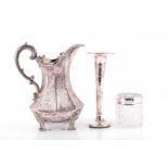 A Victorian silver milk jug. London 1850 probably by William Elliot. The jug of panelled baluster