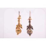 A pair of Victorian yellow gold drop earrings, with hollow orb drops, each with a small pearl in a