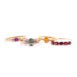 A 9ct yellow gold and garnet ring, size T 1/2, together with a 9ct yellow gold and green gemstone