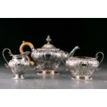 A Victorian composite three piece silver tea set. London 1891and other dates, makers marks rubbed.