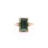 An 18ct yellow gold, diamond, and green tourmaline ring, set with a mixed rectangular-cut