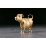 A George III silver gilt cow creamer. London 1771 by John Schuppe. The animal standing four square