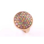 A multi gem-set dress ring; the domed cluster set with multi-coloured pink, amber and green gem