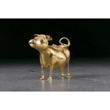 A George III silver gilt cow creamer. London 1764 by John Schuppe. The animal standing four square