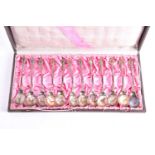 An early 20th century cased set of twelve German (800) silver sorbet spoons. With spiral twist