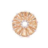 A 1970s Modernist style 18ct yellow gold and diamond brooch, of rounded design, the textured mount