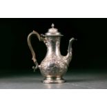 A George III silver coffee pot. London 1764 no makers mark found. With hinged domed cover above a