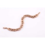 A 9ct yellow gold fancy-link chain bracelet, with smooth and textured links, marked 375 to clasp,