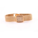 Omega. A lady's 18 carat gold 'Ladymatic' wristwatch; the brushed square dial with baton indices;