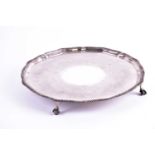 An Edwardian circular silver salver, London 1902 by The Goldsmiths company. With gadrooned