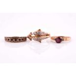 A bi-coloured ring in the form of two dolphins, set with colourless stones in 9 carat gold mount;