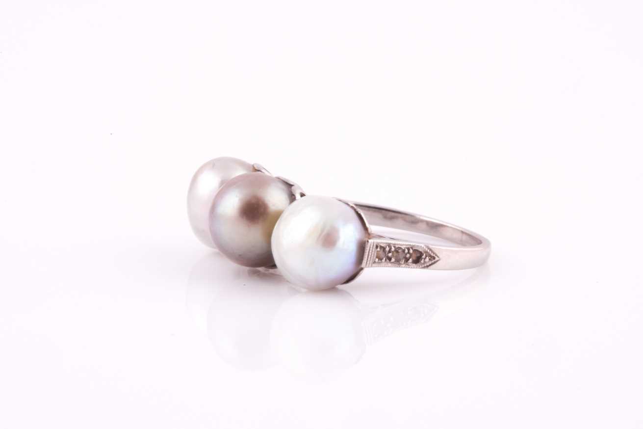 A pearl and diamond ring, set with three natural saltwater pearls, white, pale, and darker grey, the - Image 6 of 8