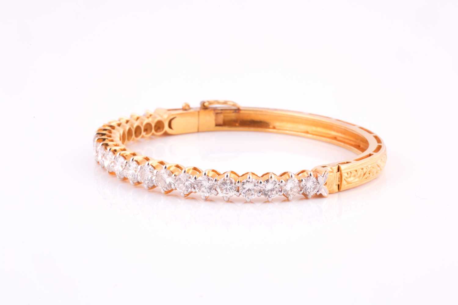 A diamond bangle; the centre set with twenty one graduated round brilliant cut diamonds in claw - Image 2 of 5