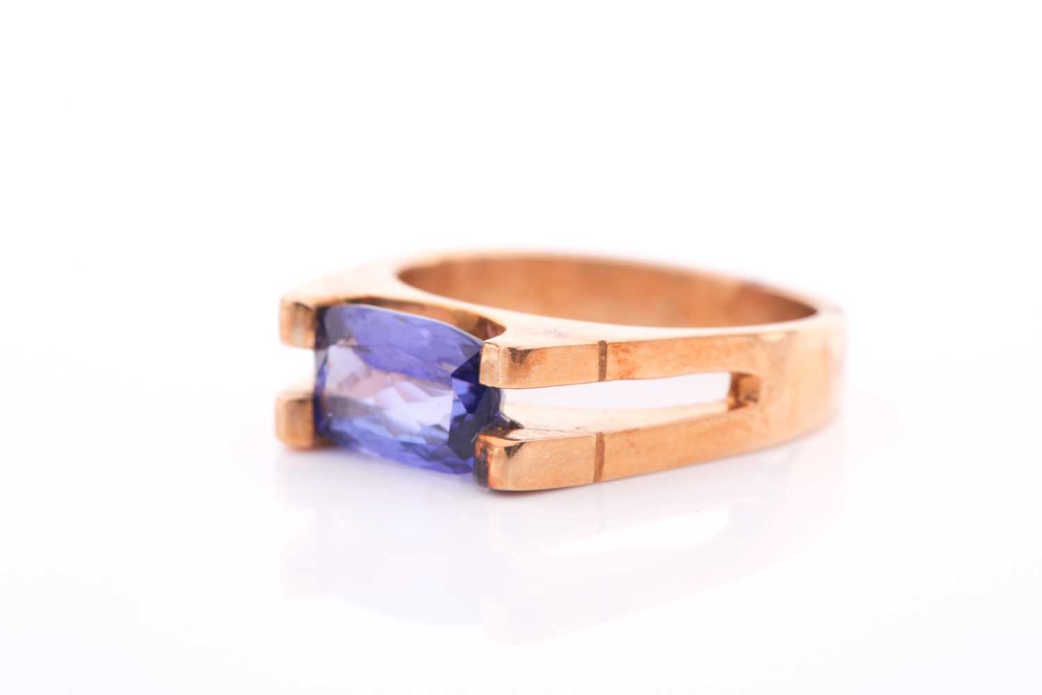 An 18ct yellow gold and tanzanite ring, set east to west with a rectangular mixed-cut tanzanite, - Image 3 of 4