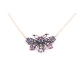 A diamond and gemstone butterfly pendant, the silvered mount inset with rose-cut diamonds, with