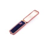 A yellow metal and diamond tie pin, set with an old-cut diamond, approximately 4 mm diameter,