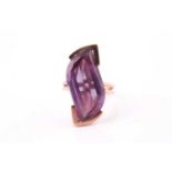 An unusual 14k yellow gold and fluorite cocktail ring, set with a fancy swirl-cut fluorite, v-shaped