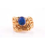 Grima. An 18ct yellow gold and blue opal ring, the textured mount inset with a dark blue opal, circa