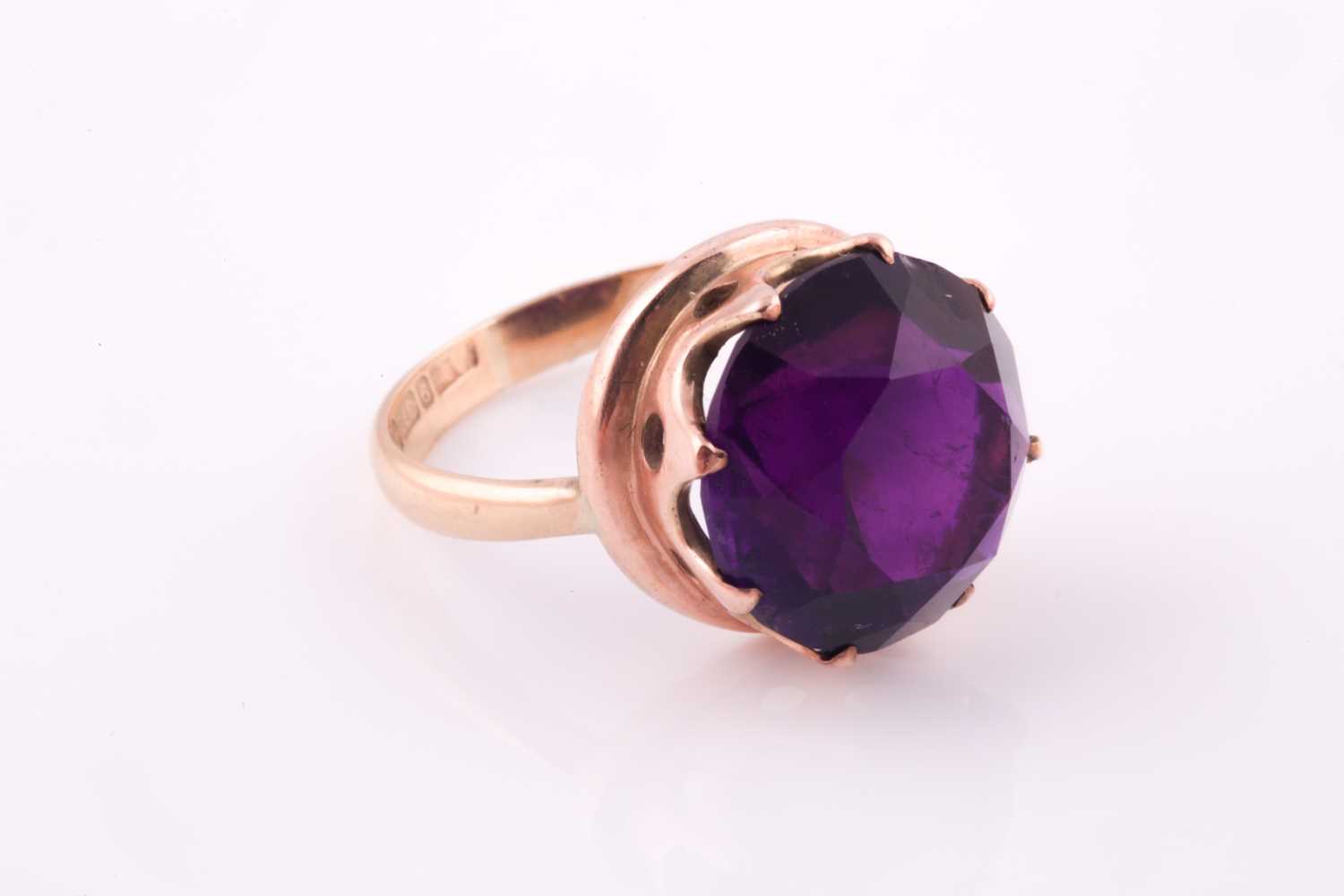 A 1960's amethyst solitaire ring, the round brilliant cut amethyst, approximately 10 carats, set - Image 4 of 5