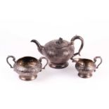 A George IV three-piece silver teaset, London 1825 by Joseph Angell, with scrolling chased