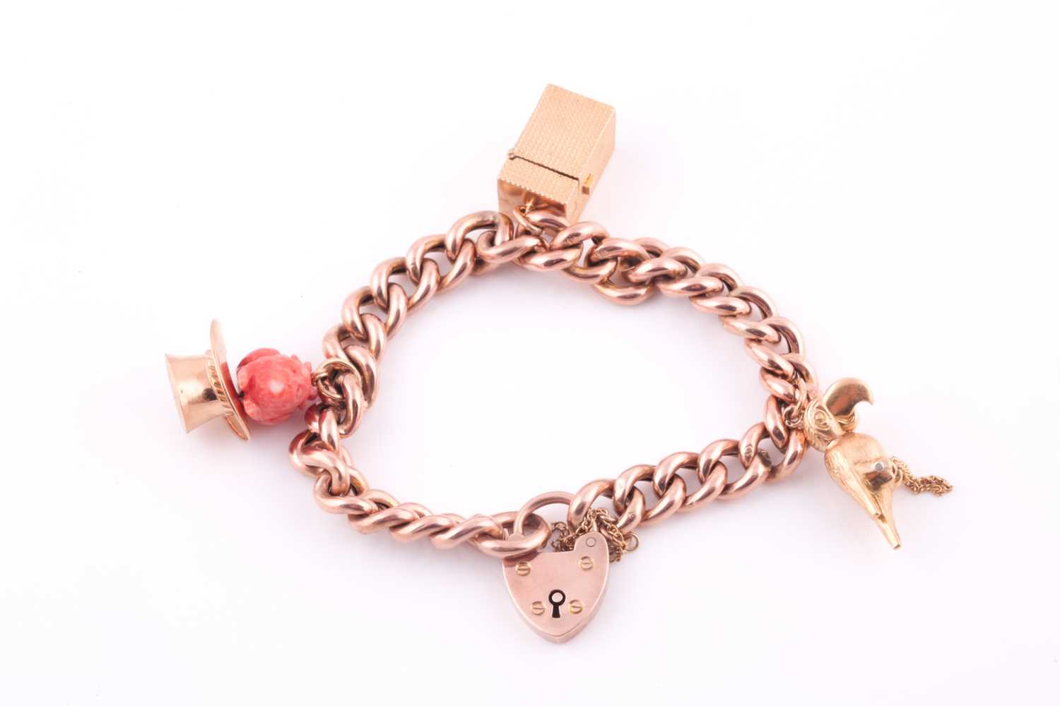 A 9ct rose gold curb-lik charm bracelet, with heart-shaped locket clasp, suspended with a yellow