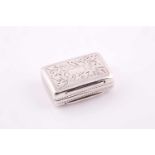 A small Victorian vinaigrette; Birmingham 1845 by Edward Smith; rounded rectangular with prick and